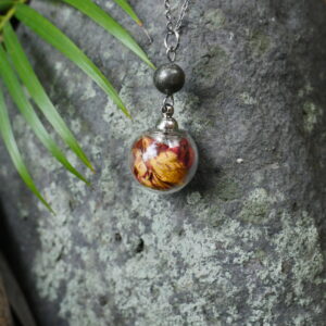 collier sphère argenté succès